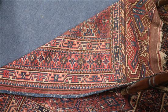 A Bokhara rug with traditional all-over panelled design, 150cm x 145cm